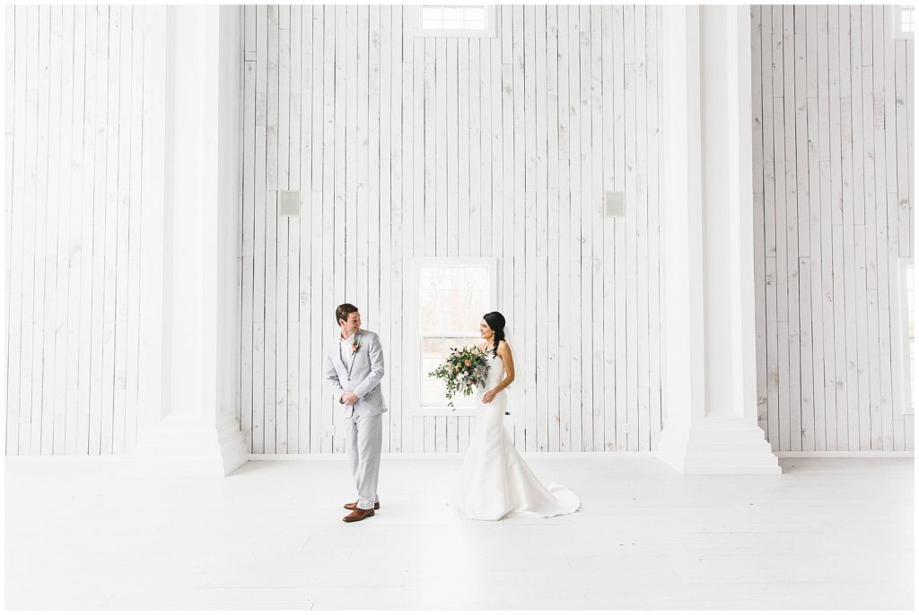 First look at the White Sparrow with groom turning around to see his bride.