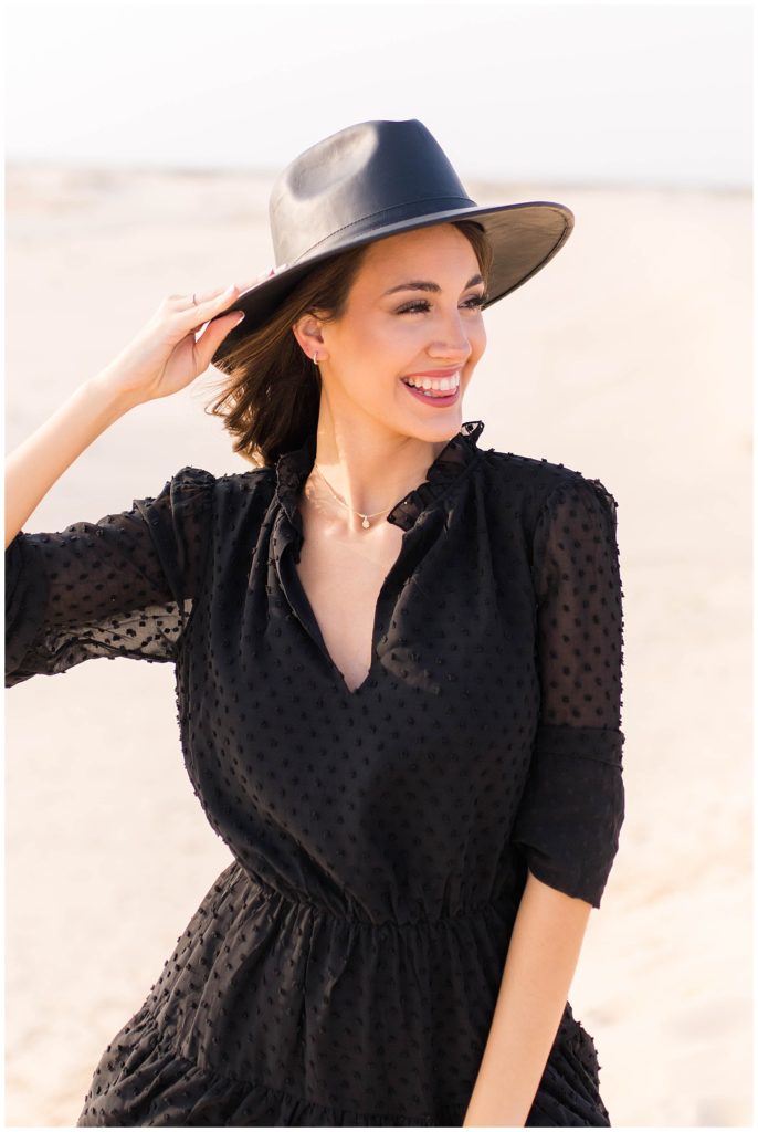 Girl in black dress and hat