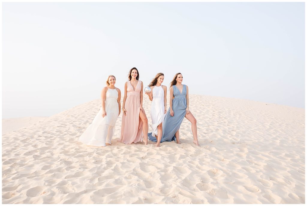 Senior Adventure Session at the sand dunes in pastel dresses